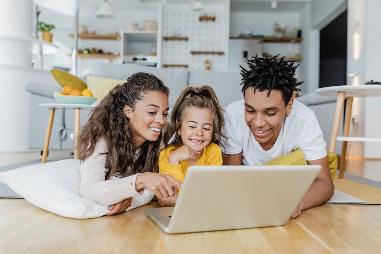 Parents with child looking at a computer