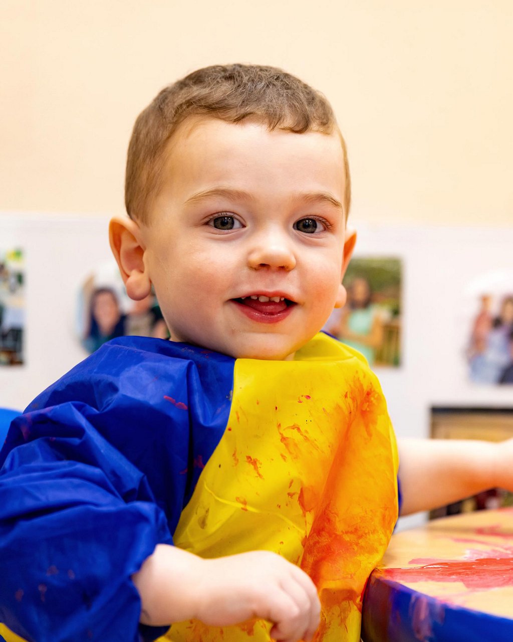 A child playing with paint 