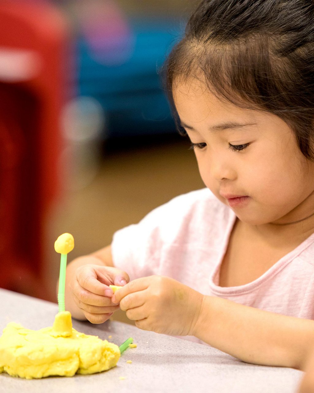 A child playing with clay 