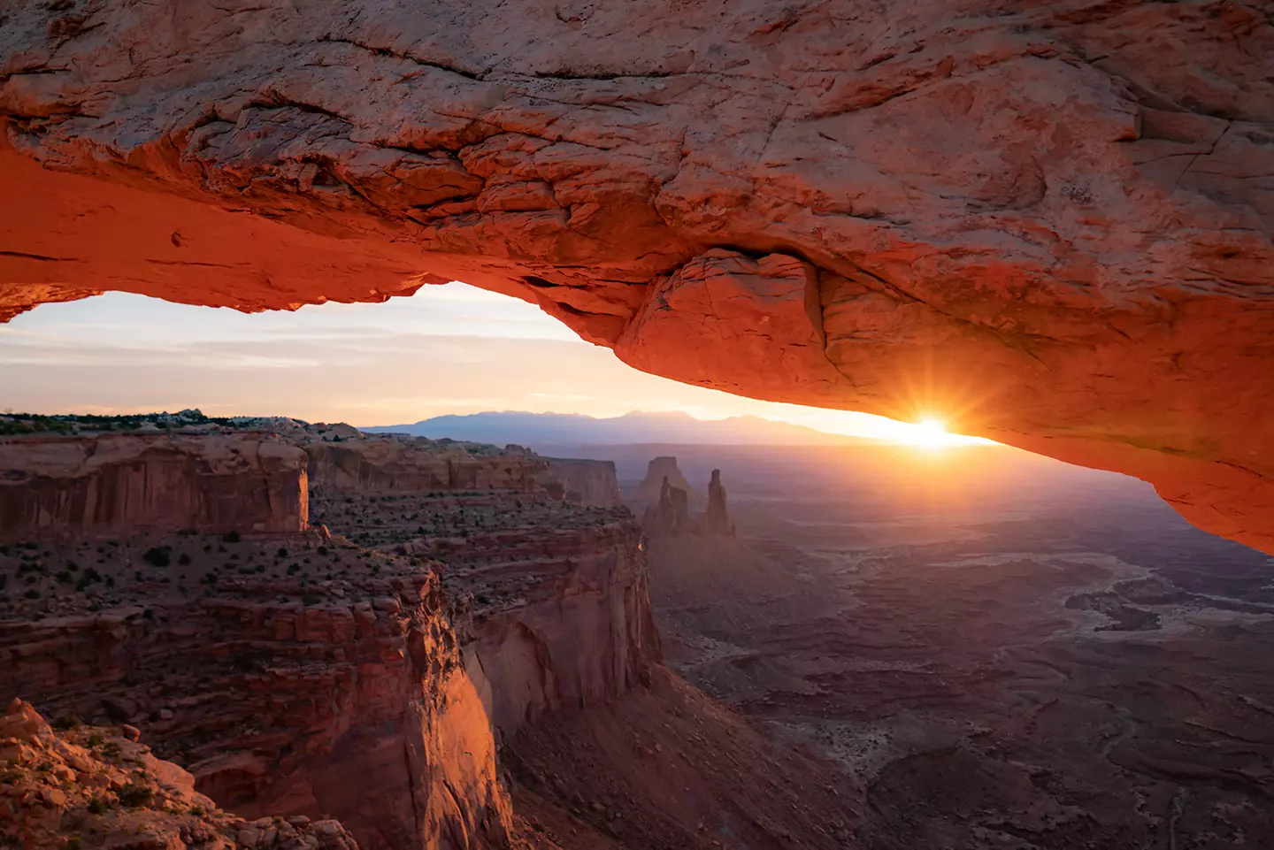 Sunrise behind Arches in Utah