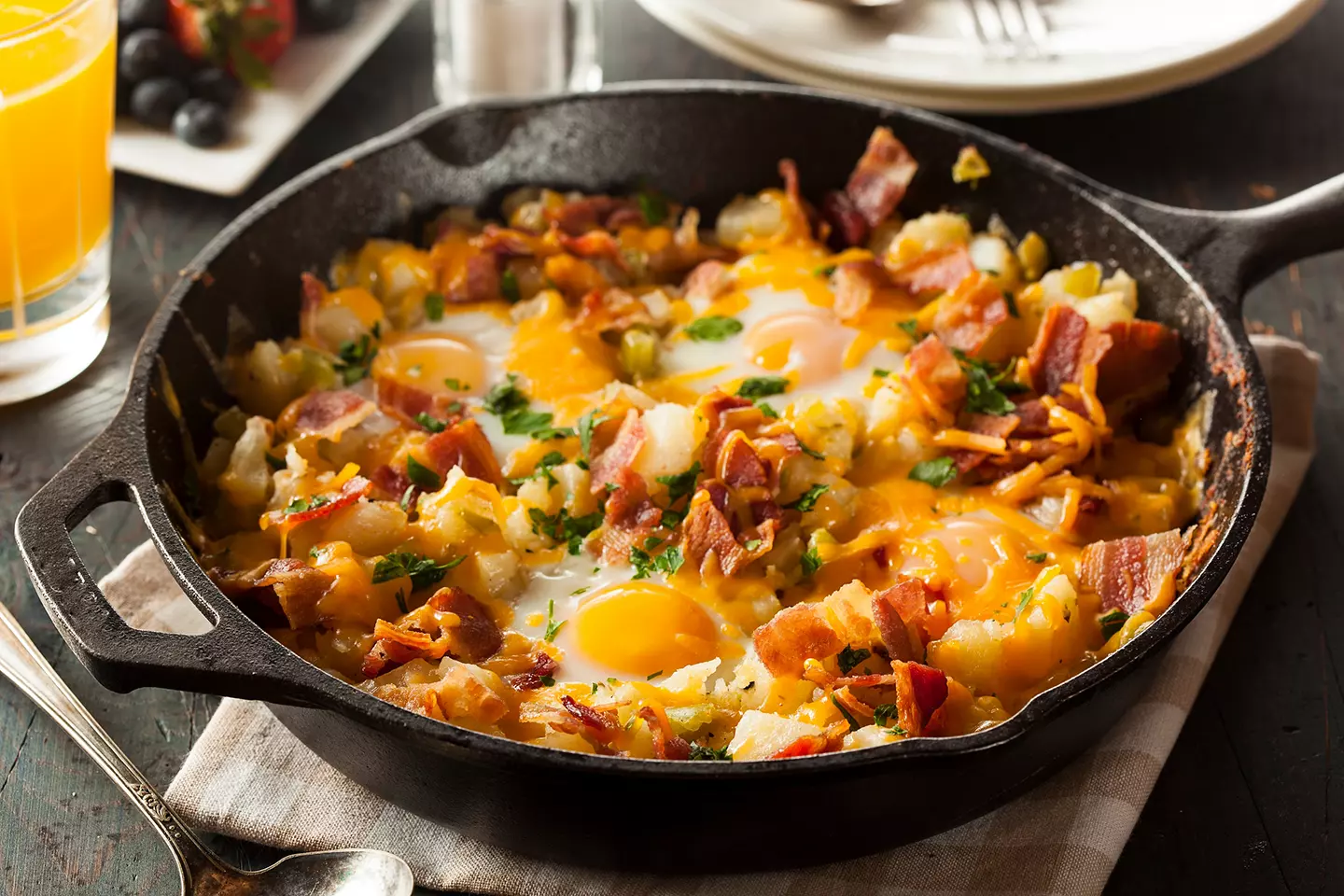 Food cooking in a cast-iron skillet