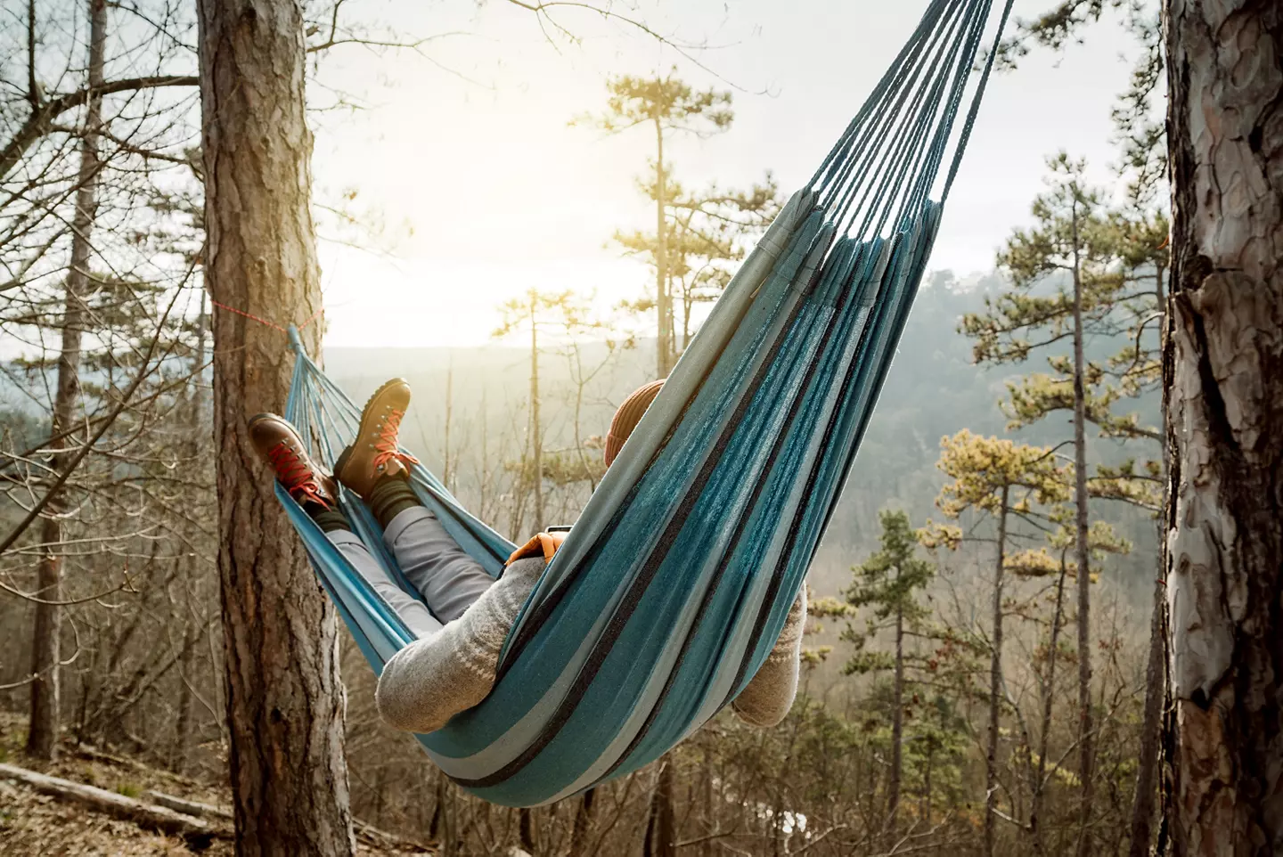 Camper enjoying the view from a hammock.
