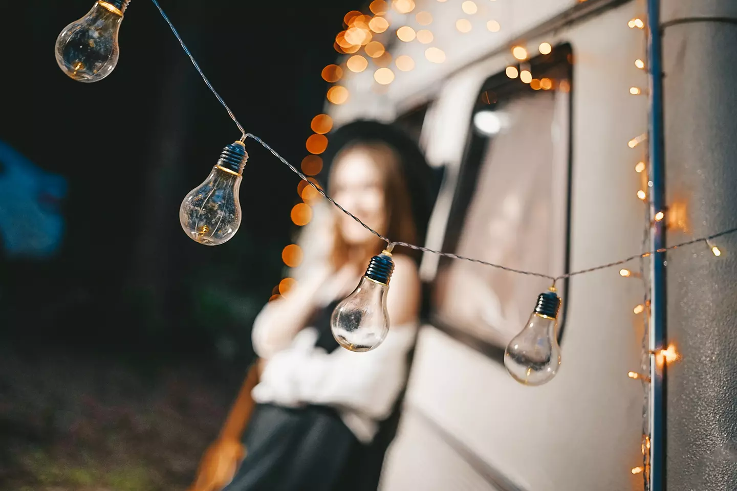 Fairy lights in front of a camper.