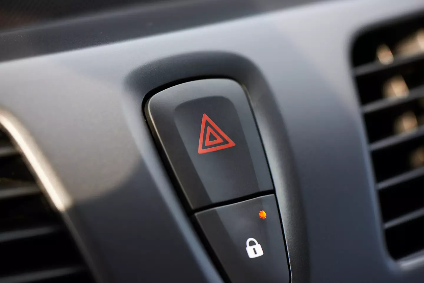 hazard warning light button for warning other drivers that the vehicle is a temporary obstruction