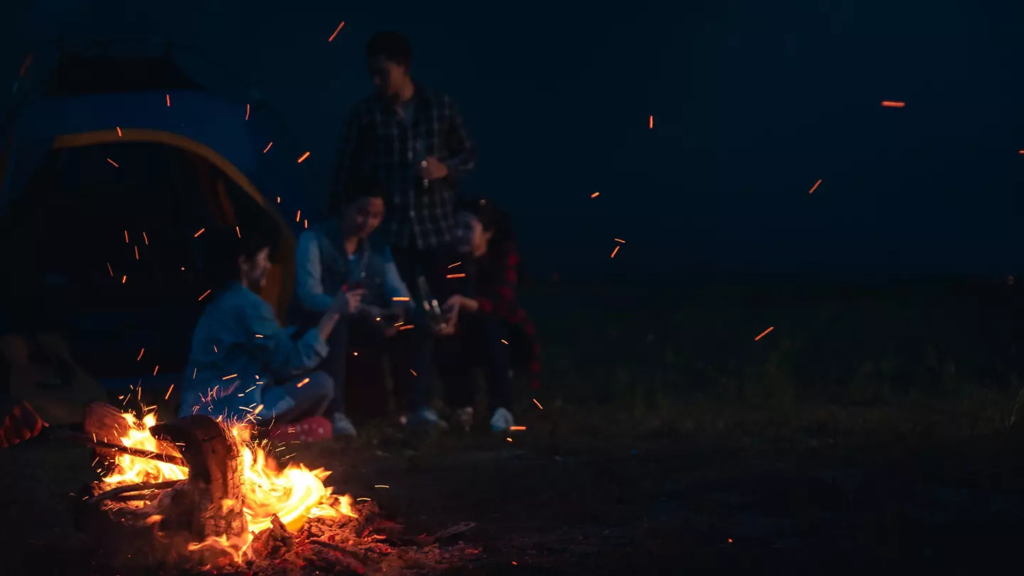 group sitting around campfire telling stories