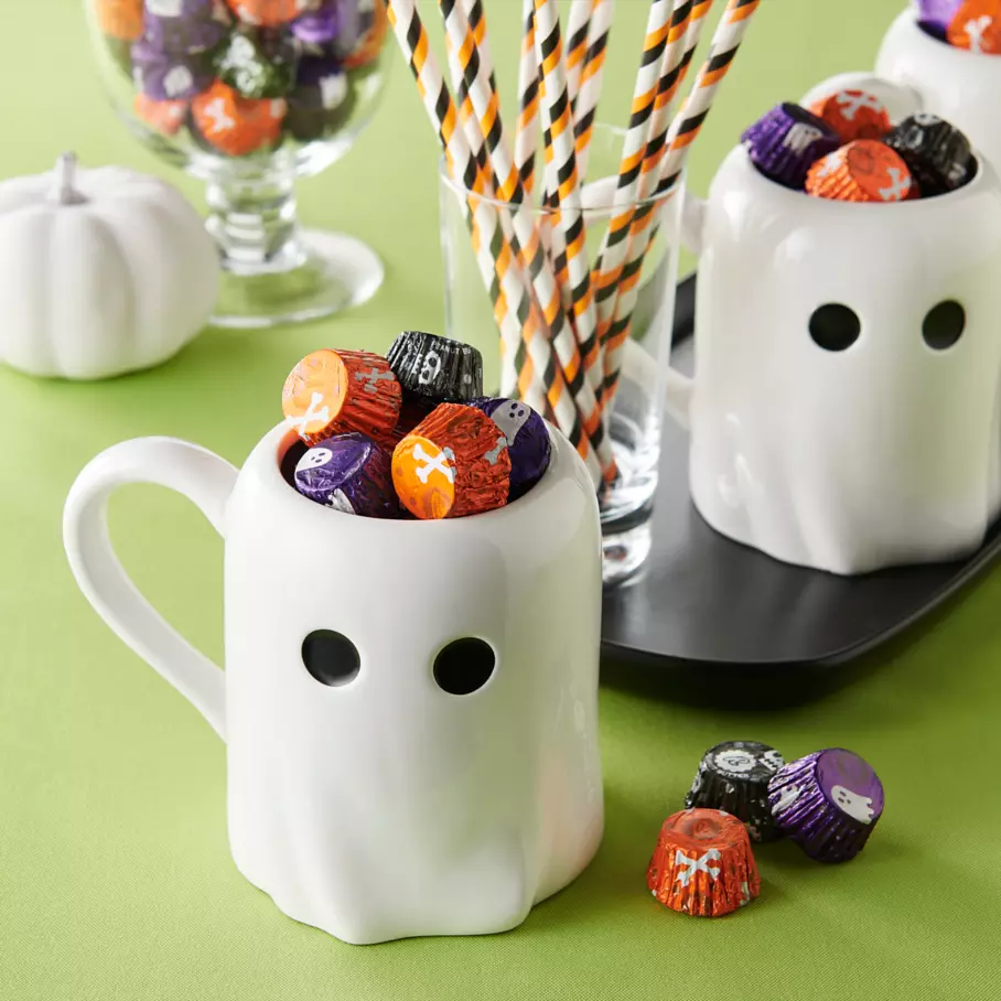 Ghost mugs filled with reeses miniatures milk chocolate peanut butter cups