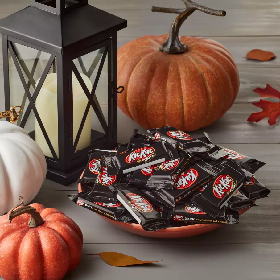 Bowl full of kit kat halloween dark chocolate snack size candy bars on front porch
