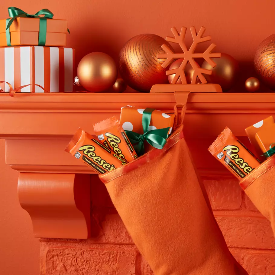 christmas stockings filled with packs of reeses holiday milk chocolate peanut butter cups