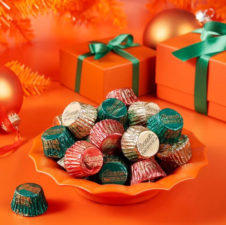 orange bowl filled with reeses holiday milk chocolate miniatures peanut butter cups