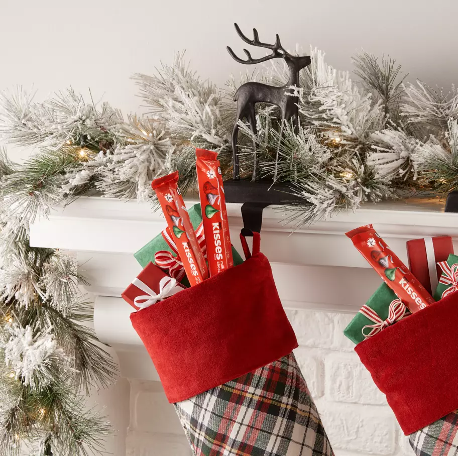 christmas stockings filled with sleeves of hersheys kisses holiday milk chocolate candy