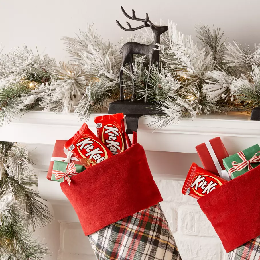 christmas stockings filled with gifts and kit kat milk chocolate candy bars
