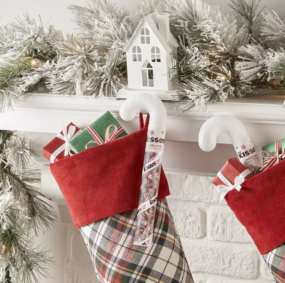 hersheys kisses mint candy canes hanging from christmas stockings