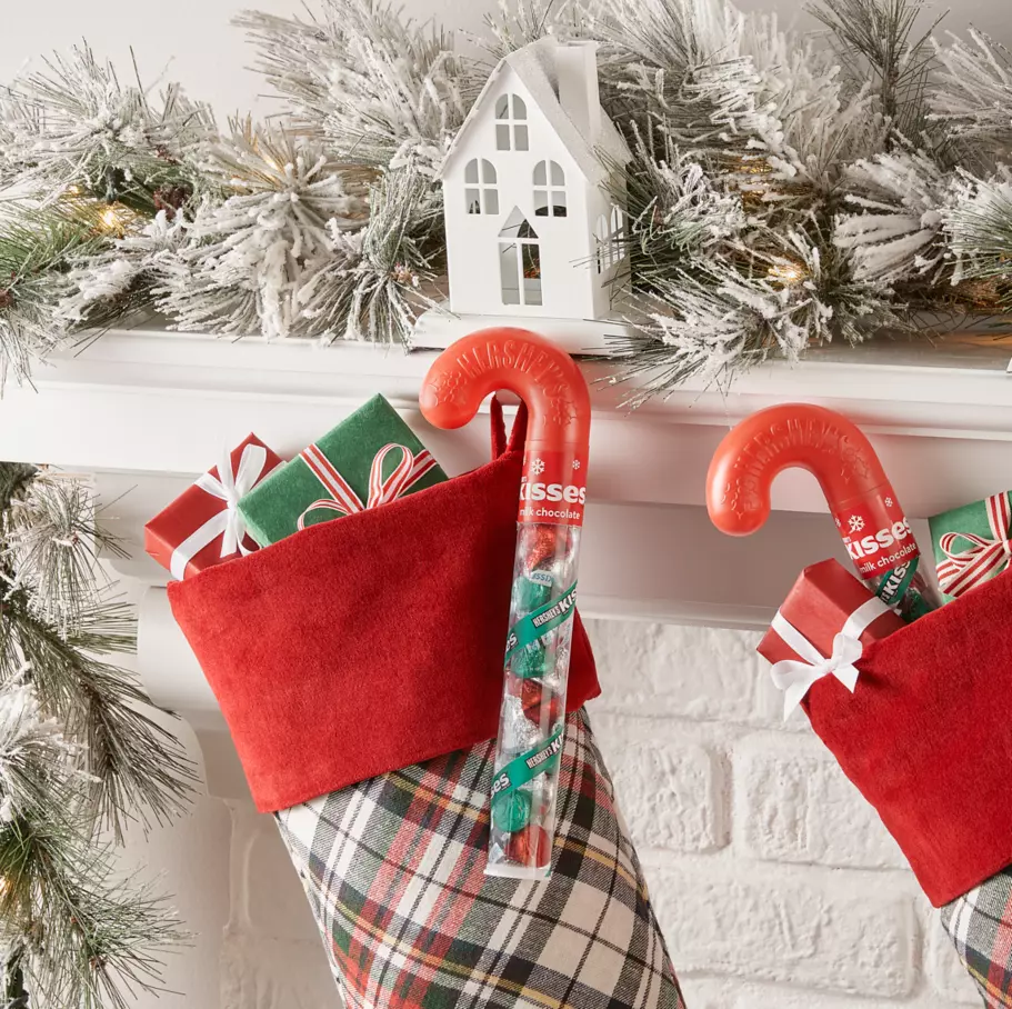 HERSHEY'S KISSES Candy Canes hanging on Christmas stockings