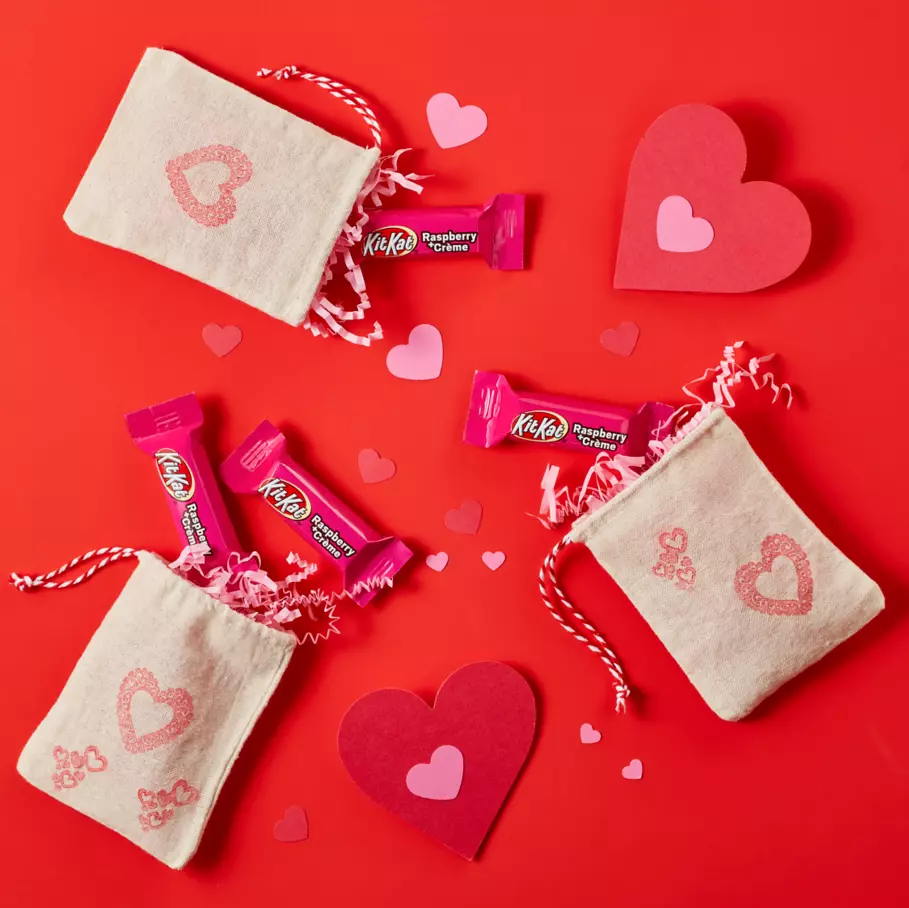 small cloth pouches filled with kit kat valentines raspberry creme miniatures candy bars