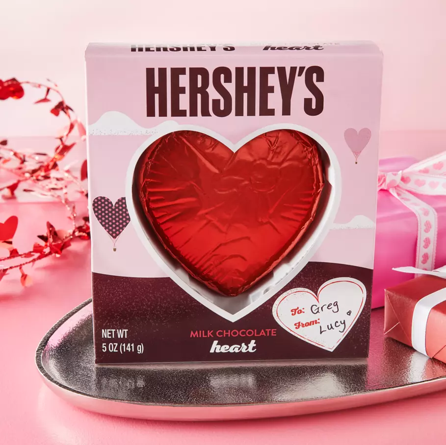 HERSHEY'S Milk Chocolate Heart surrounded by gifts
