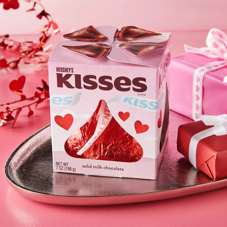 HERSHEY'S KISSES Milk Chocolate Giant Candy Package surrounded by gifts