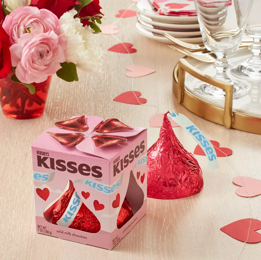 hersheys kisses valentines milk chocolate giant candy package beside bouquet of flowers