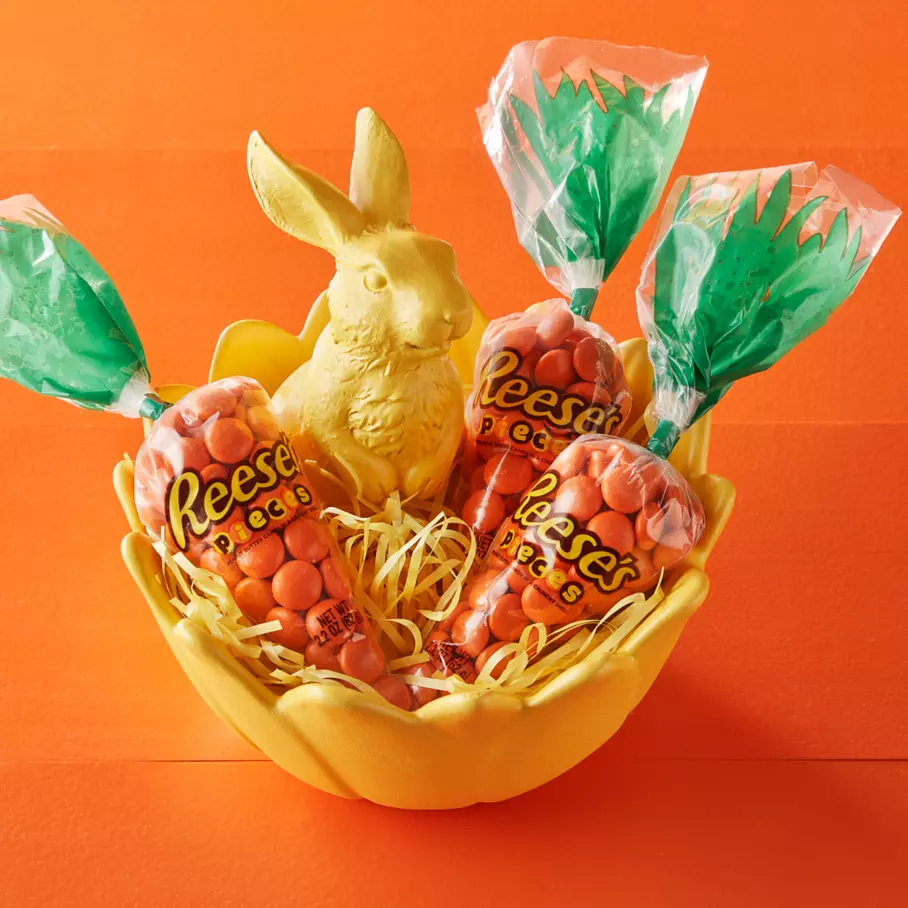 REESE'S PIECES Carrots inside Easter egg shaped bowl