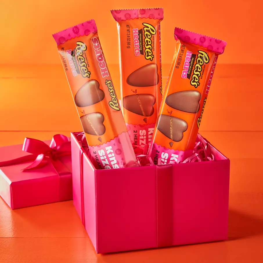 Packages of REESE'S Milk Chocolate Peanut Butter King Size Hearts inside gift box