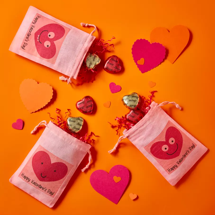REESE'S Milk Chocolate Peanut Butter Hearts inside festive pouches