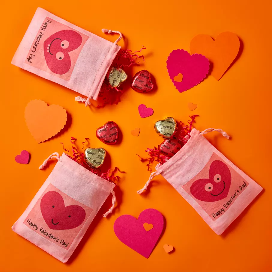 small cloth pouches filled with reeses milk chocolate peanut butter hearts