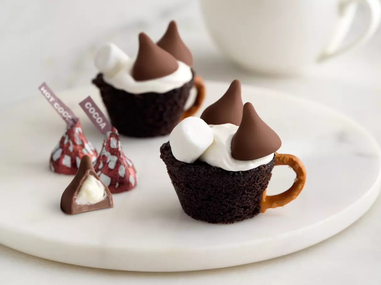 tray of freshly made hersheys kisses hot cocoa cupcakes