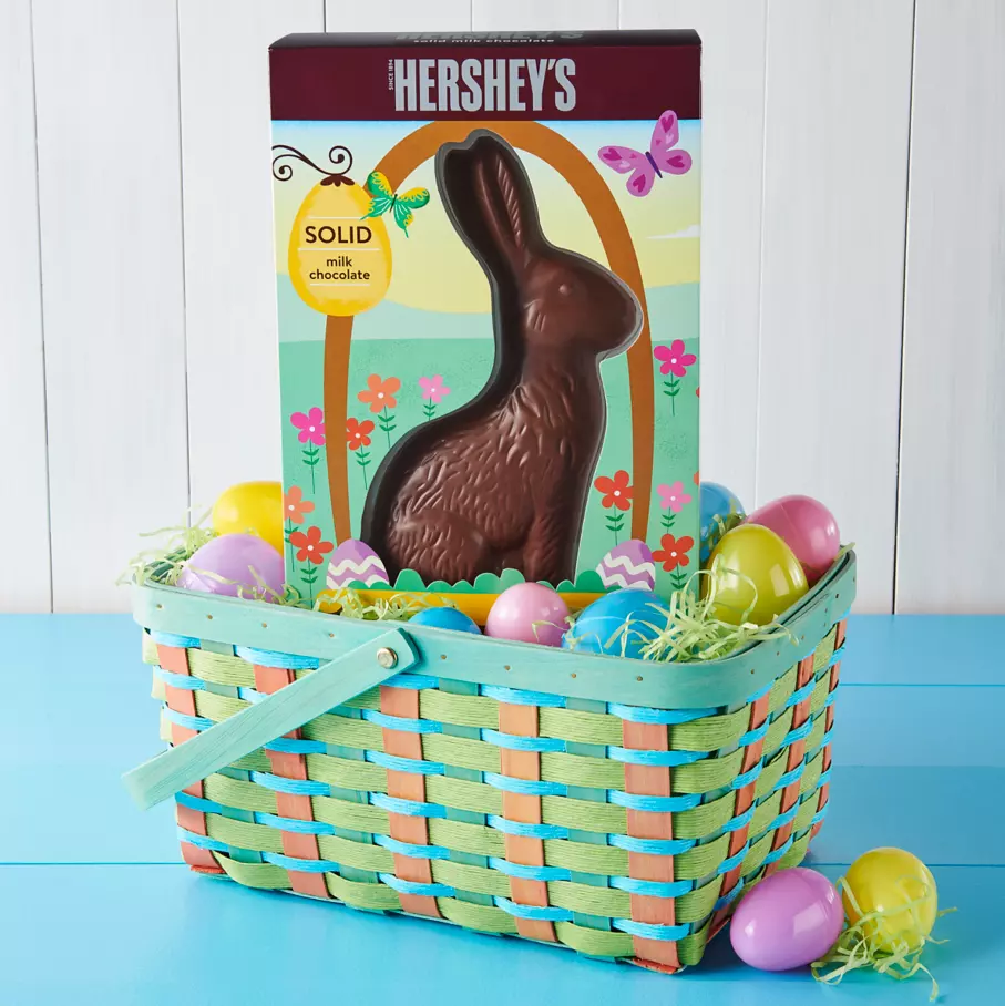 easter basket filled with box of hersheys solid milk chocolate bunny