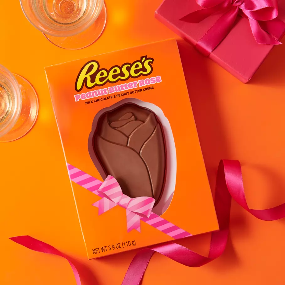 reeses milk chocolate peanut butter creme rose package beside wrapping supplies