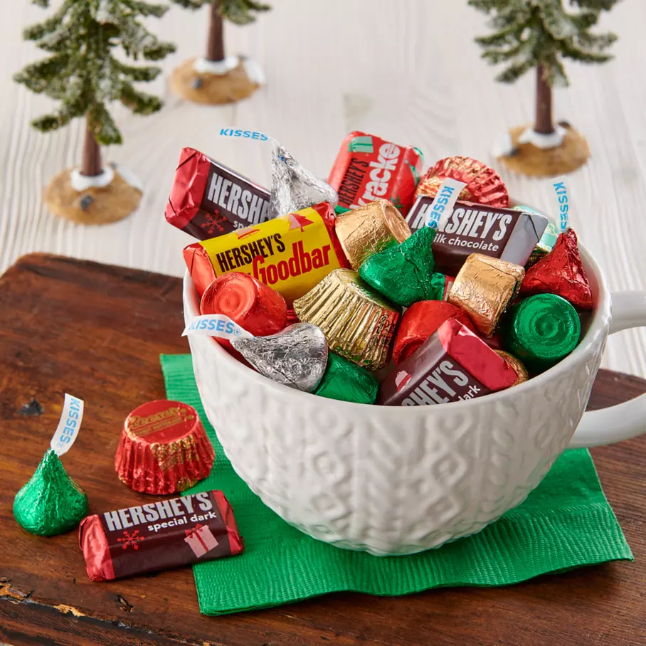 Christmas mug full of assorted Hershey candy