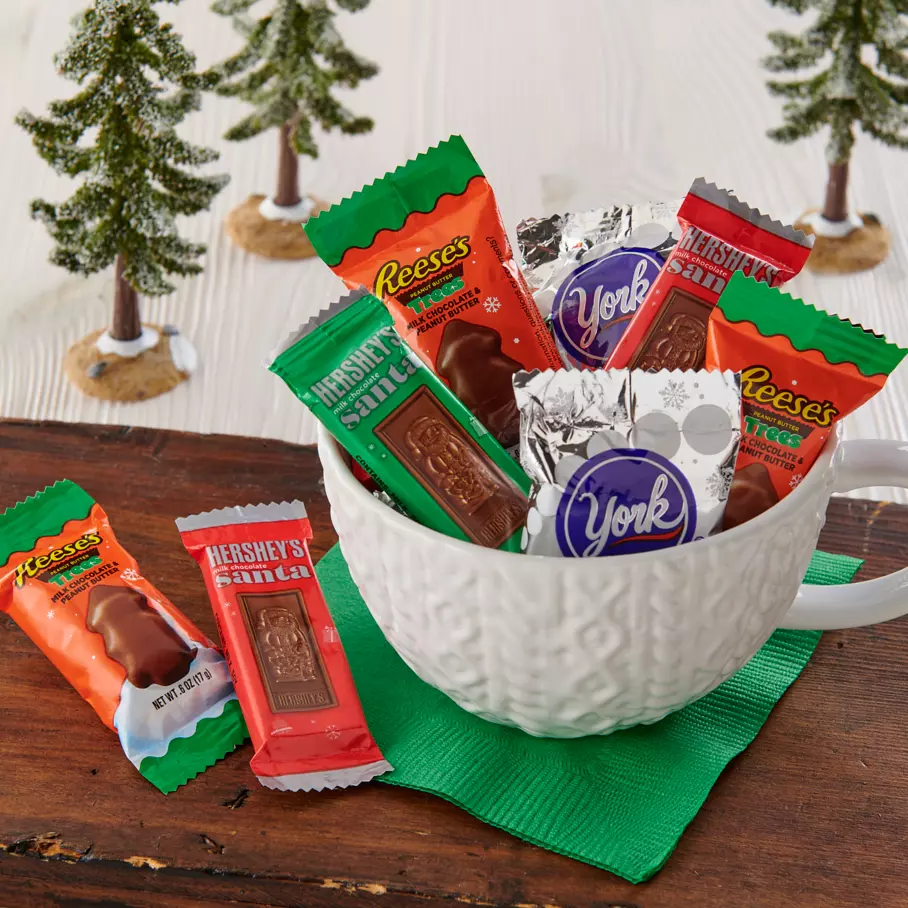 Christmas mug full of Assorted Hershey Stocking Stuffer Candy