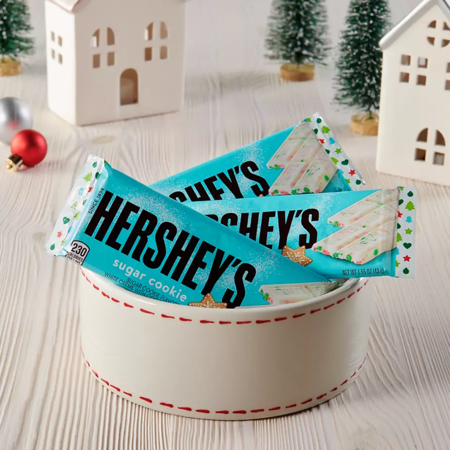holiday themed bowl filled with hersheys holiday sugar cookie candy bars
