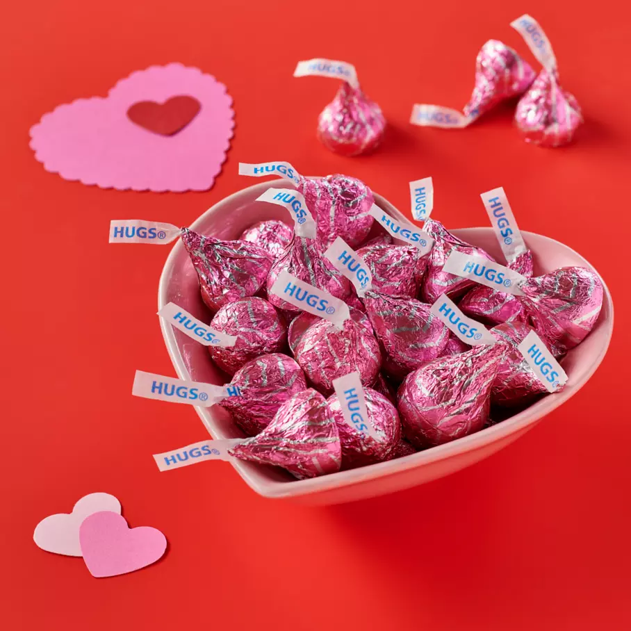 heart shaped bowl filled with hersheys hugs valentines milk chocolate and white creme candy