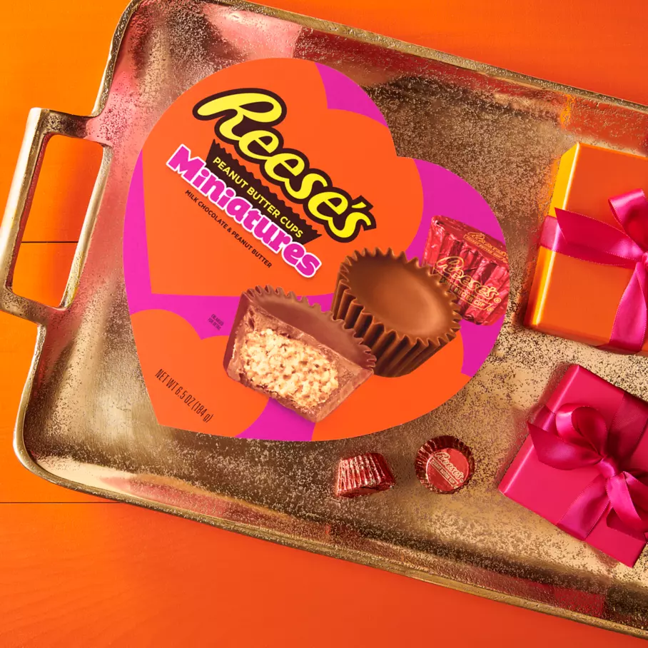 reeses valentines milk chocolate miniatures peanut butter cups package on tray of wrapped gifts