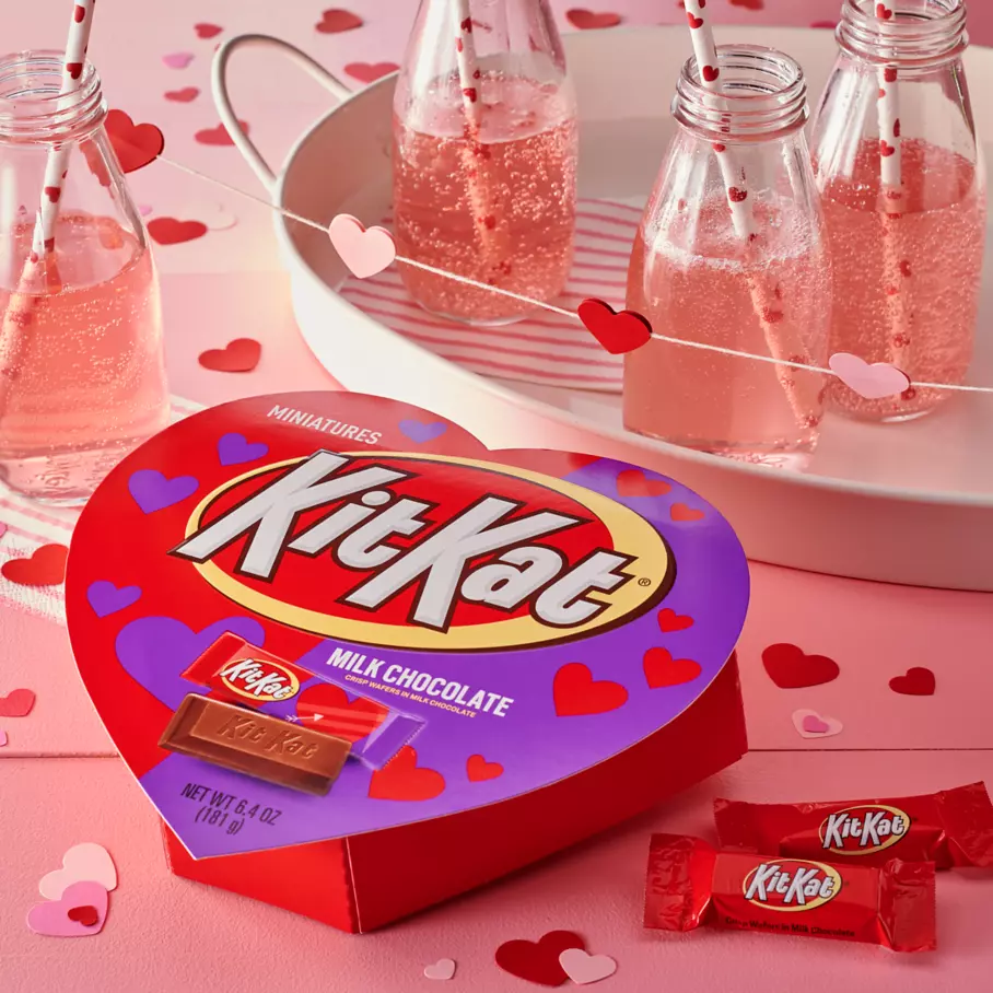 KIT KAT® Valentine's Candy Bars Box on deocrative table with paper hearts