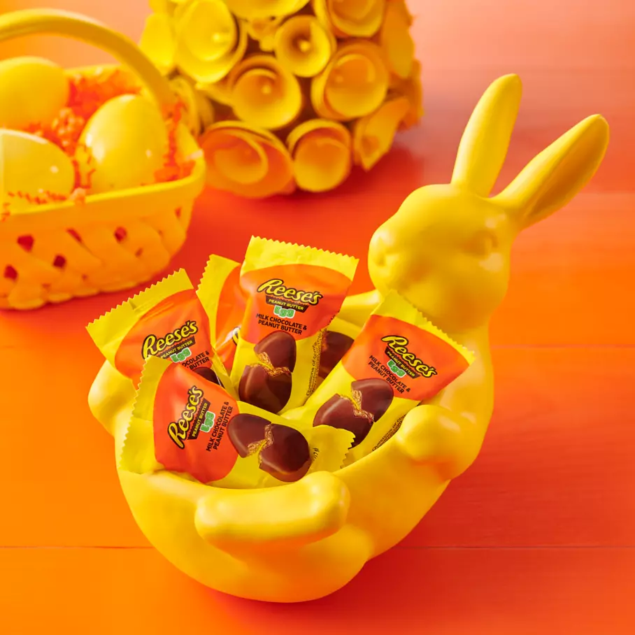 bunny shaped bowl filled with packs of reeses milk chocolate peanut butter snack size eggs