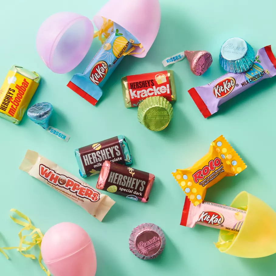 Assorted Hershey Candies beside plastic Easter eggs