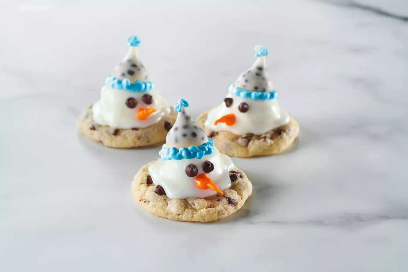sugar cookies decorated like melted snowmen