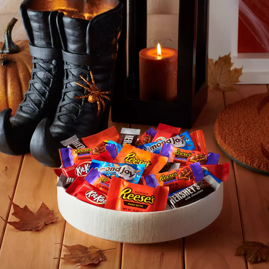 Bowl full of assorted hersheys snack size candy on front porch