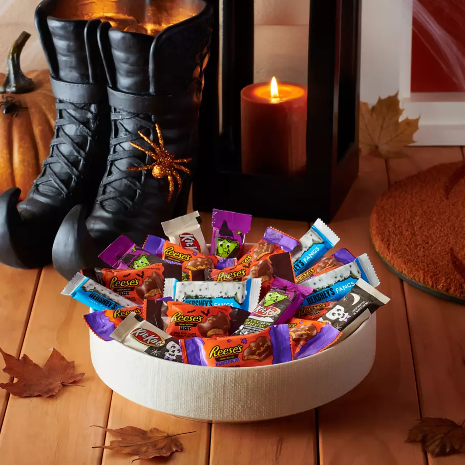 Bowl full of assorted hersheys snack size candy on front porch