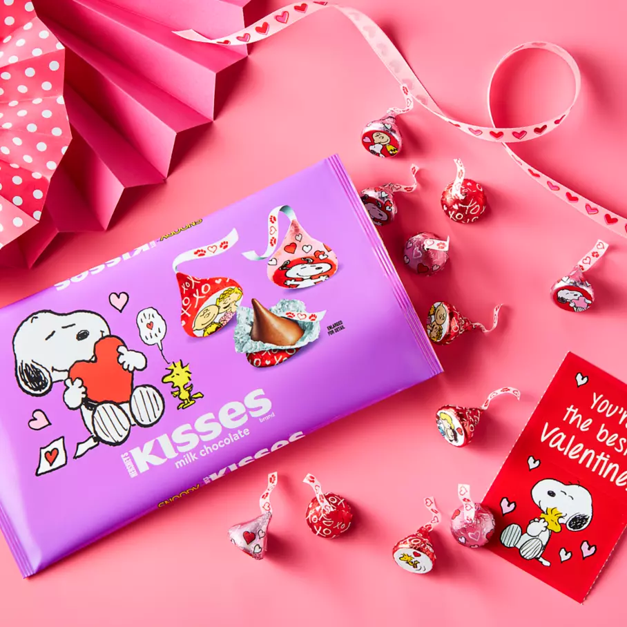 bag of hersheys kisses snoopy and friends foils milk chocolate candy beside valentine cards and ribbon