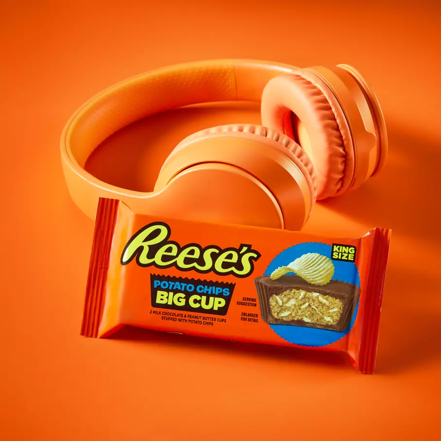 REESE'S Big Cup with Potato Chips beside pair of headphones