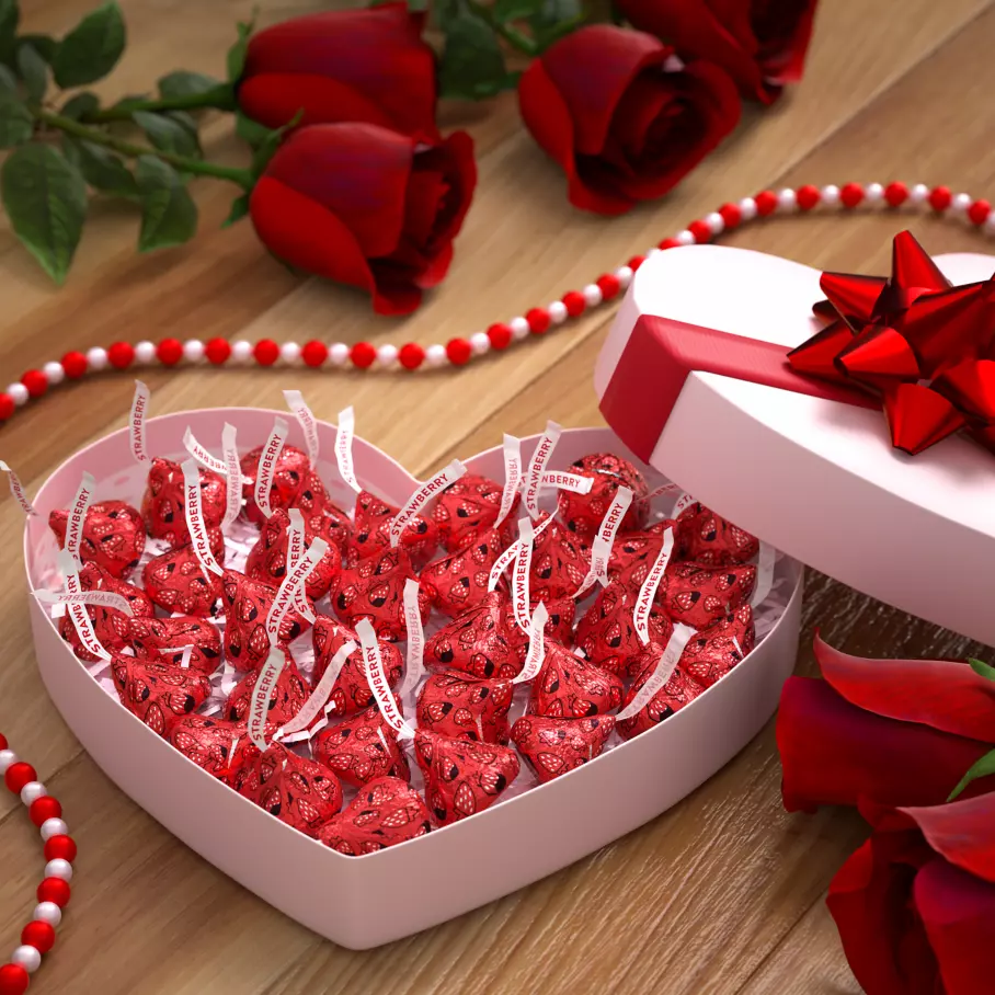Heart shaped gift box filled with HERSHEY'S KISSES Strawberry Candies