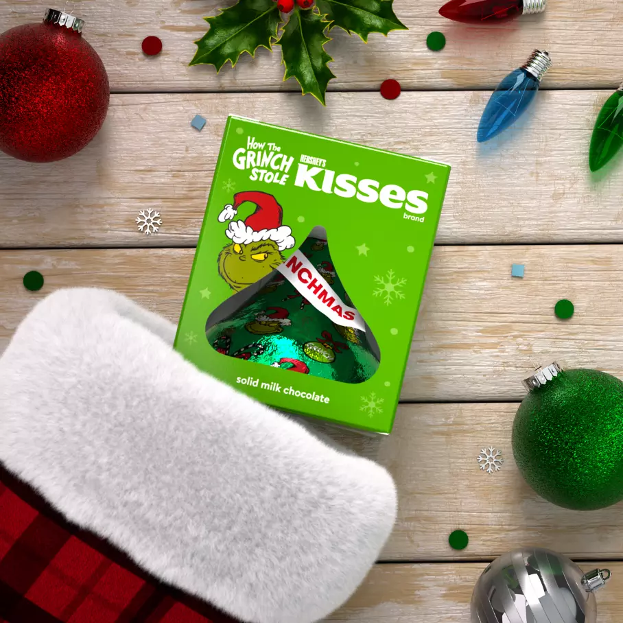 HERSHEY'S KISSES Grinch® box inside Christmas stocking