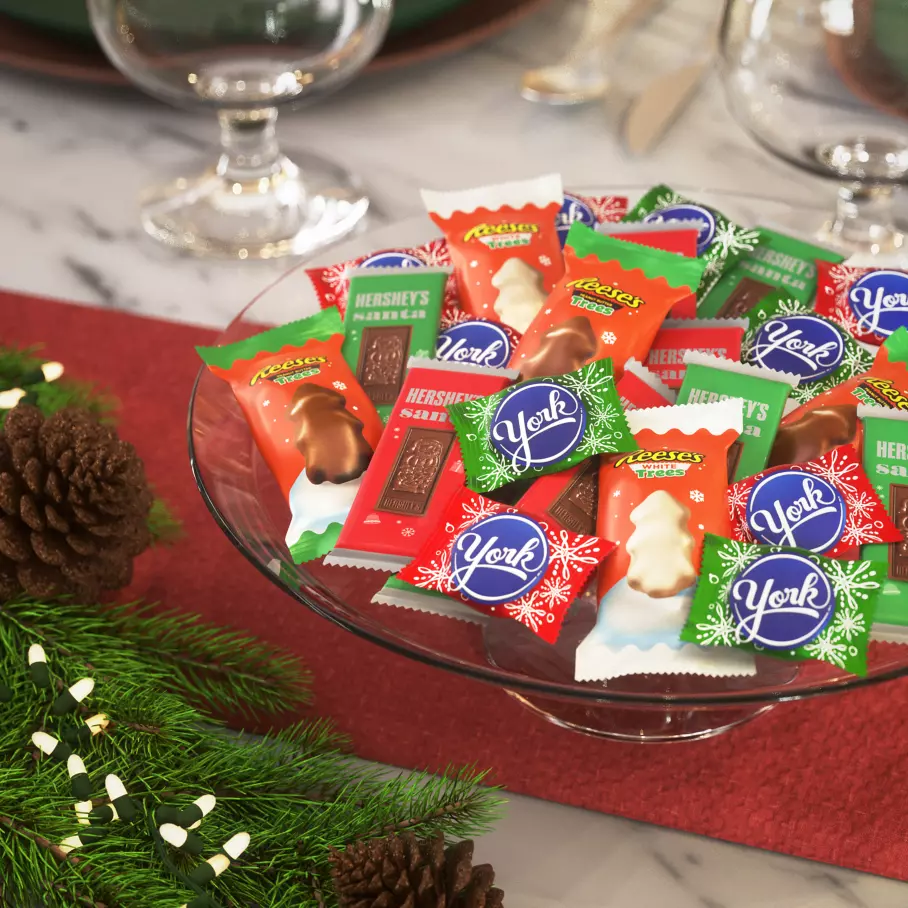 clear glass bowl filled with assorted hersheys stocking stuffer shapes candy