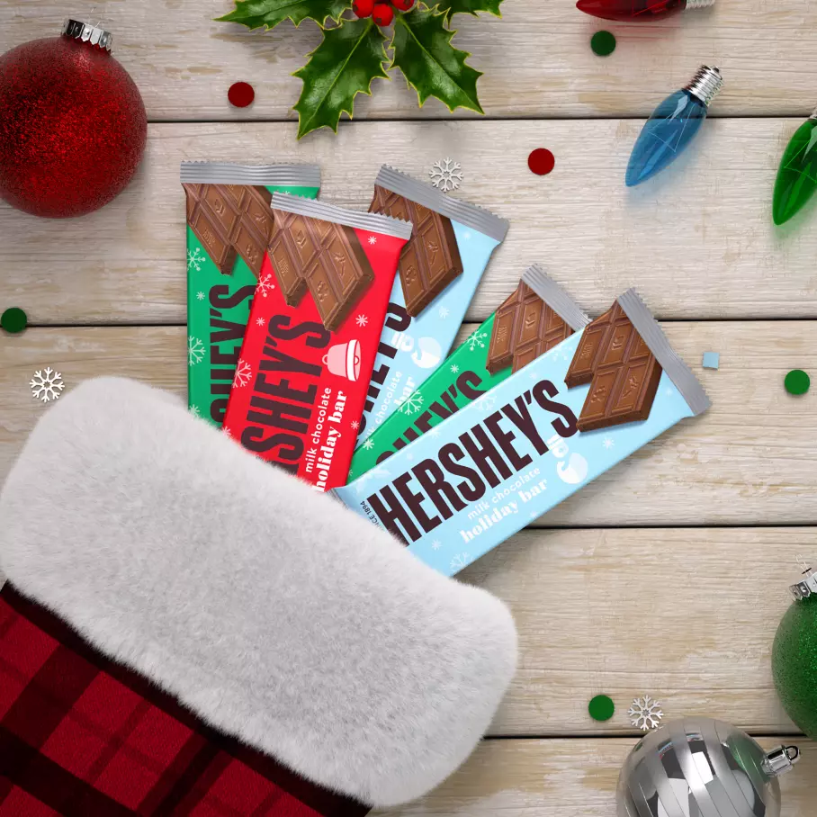 christmas stocking filled with assorted hersheys milk chocolate holiday candy bars