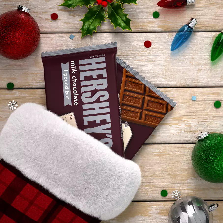 christmas stocking filled with hersheys holiday milk chocolate candy bars