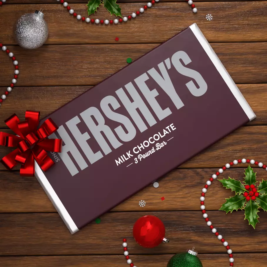 HERSHEY'S Milk Chocolate Candy Bar surrounded by Christmas ornaments