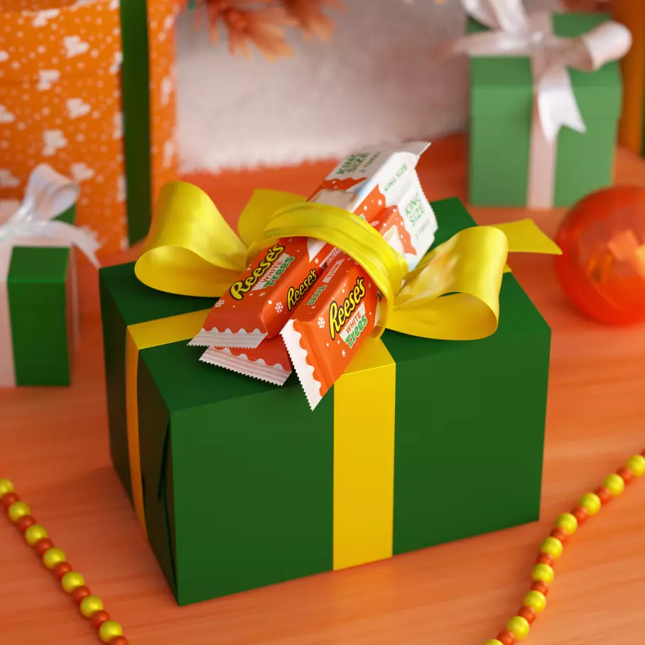 wrapped gifts topped with reeses white creme peanut butter king size trees