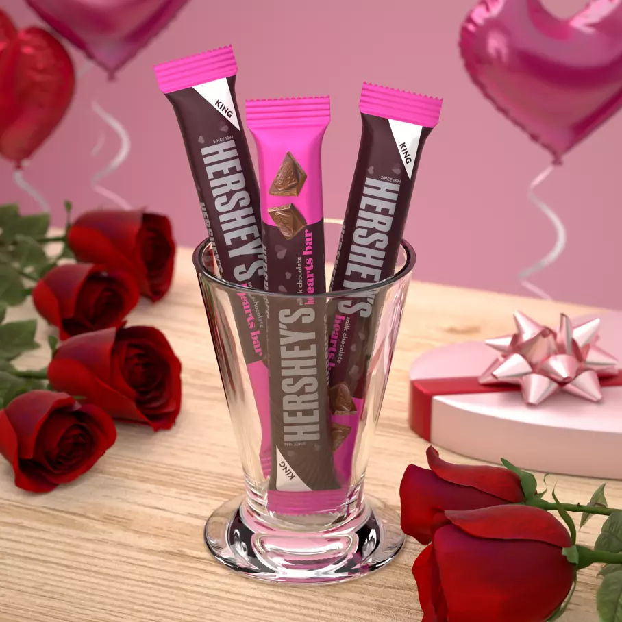 Decorative glass filled with HERSHEY'S Milk Chocolate King Size Hearts Bars