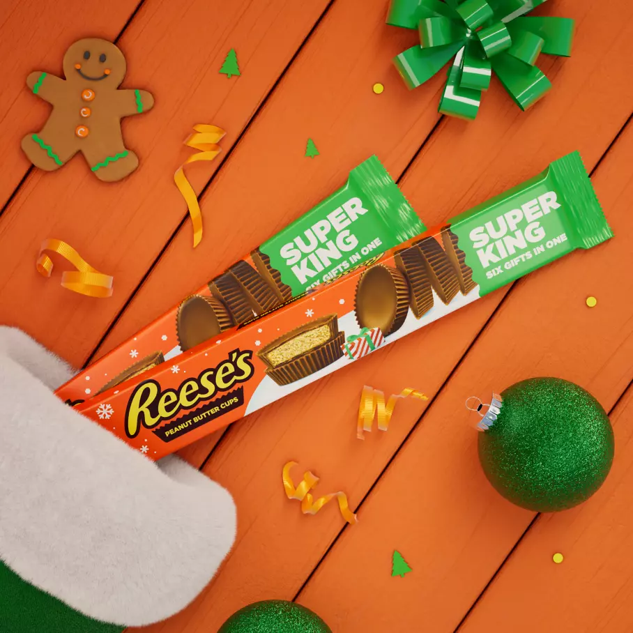 christmas stocking filled with packs of reeses milk chocolate super king peanut butter cups